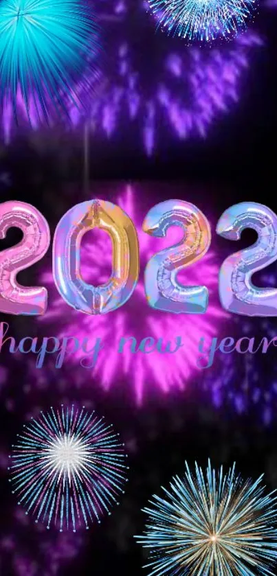 Colorful fireworks and '2022' text New Year wallpaper.