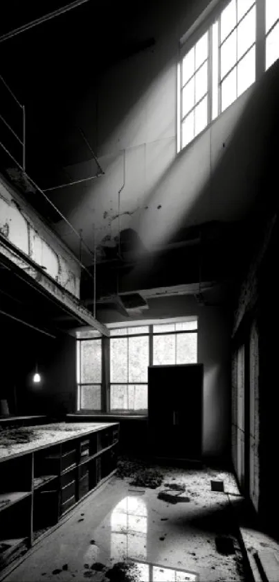 Black and white wallpaper of an abandoned industrial space with windows.