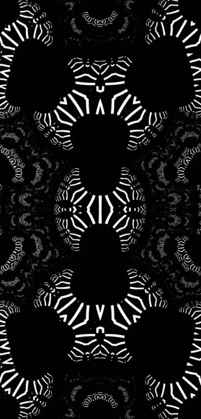 Intricate black and white geometric pattern wallpaper.