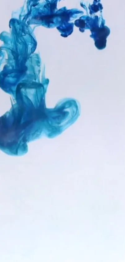 Abstract blue ink swirling elegantly on a white background.