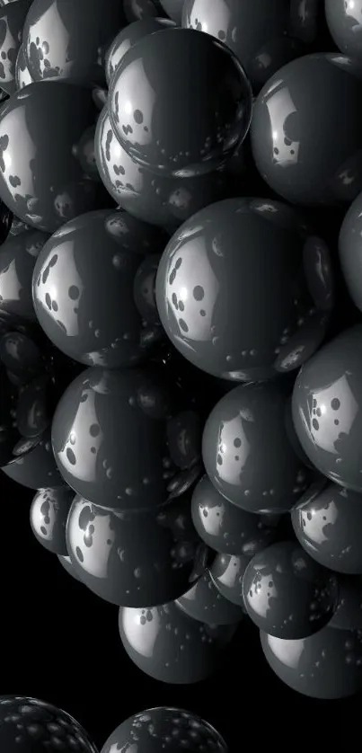 Mobile wallpaper with glossy black spheres on a dark background.