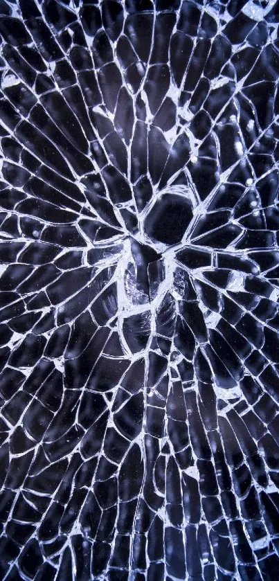 Shattered glass design with blue hue on phone wallpaper.