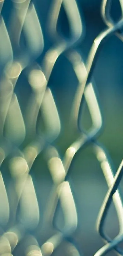 Abstract metallic wire chain with blurred background.