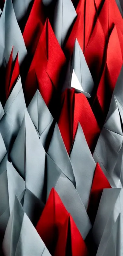 Abstract origami wallpaper with red and gray geometric shapes.