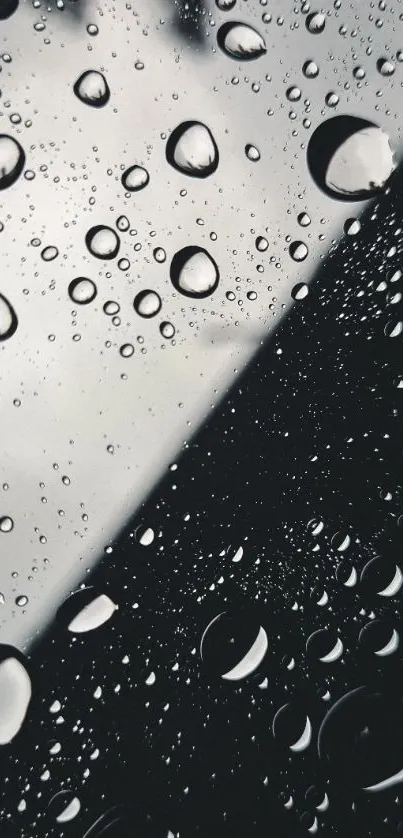 Abstract raindrop design in dark gray tones for phone wallpaper.