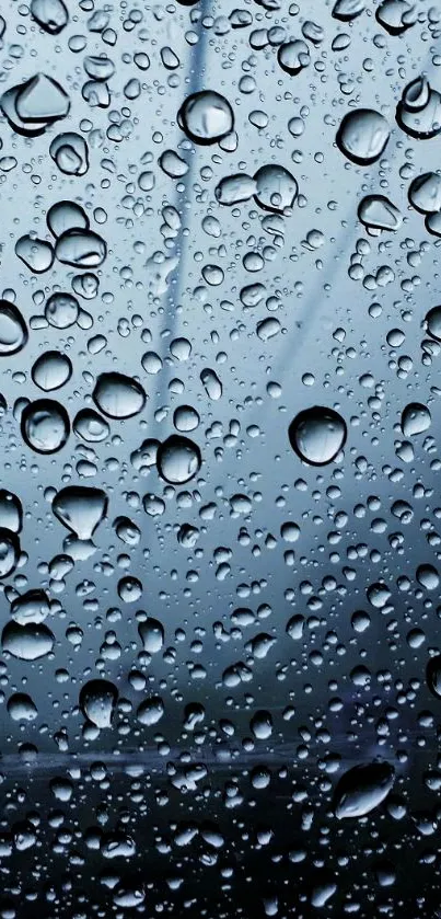 Mobile wallpaper with abstract raindrop pattern on blue-gray background.