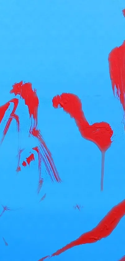 Abstract red brush strokes on blue background wallpaper.