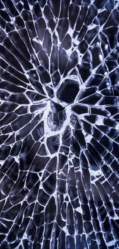 Shattered glass wallpaper with dark blue tones and intricate crack design.