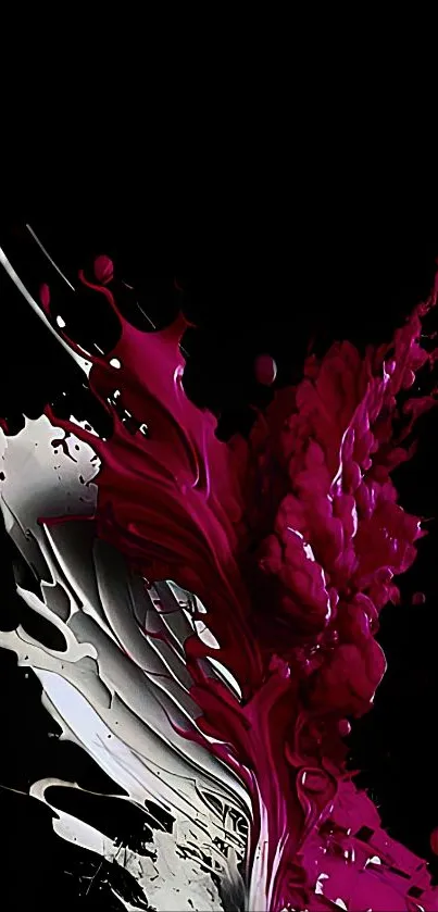 Dynamic abstract magenta splash on a black background wallpaper.