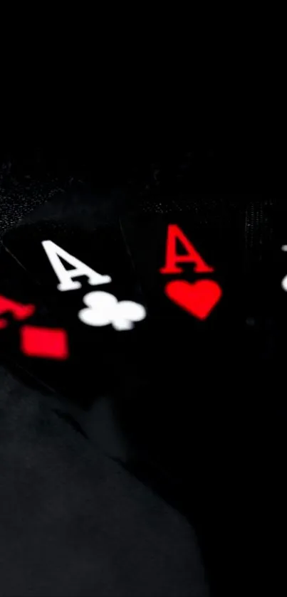 Aces poker card wallpaper with a black background and red accents.