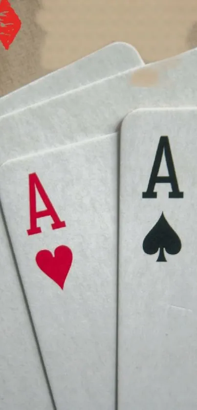 Three playing cards with aces design.