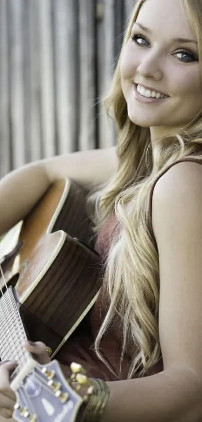 Young woman playing acoustic guitar outdoors.