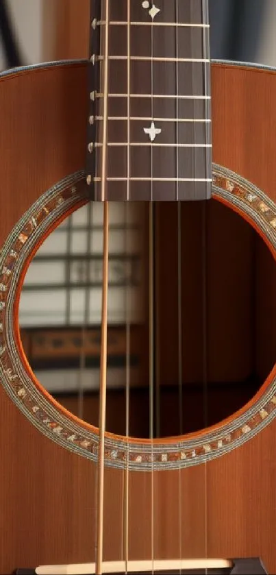 Close-up view of acoustic guitar with detailed strings and brown wooden texture.