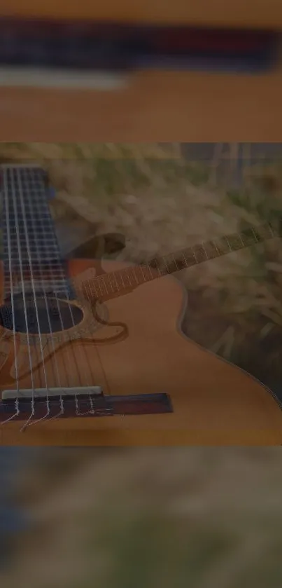 Acoustic guitar resting on grass in serene natural setting.