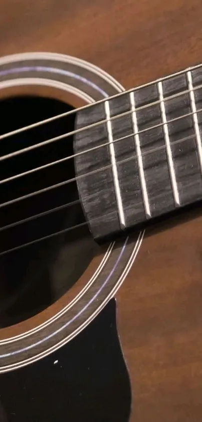 Close-up of acoustic guitar strings on a wooden body, highlighting texture and detail.