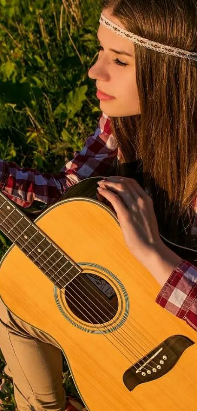 Young woman playing guitar during a serene sunset in nature, exuding peaceful vibes.