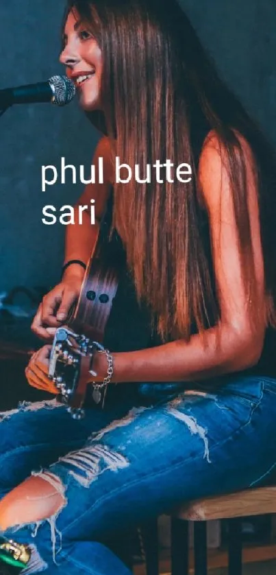 Female musician playing acoustic guitar on stage in cozy setting.