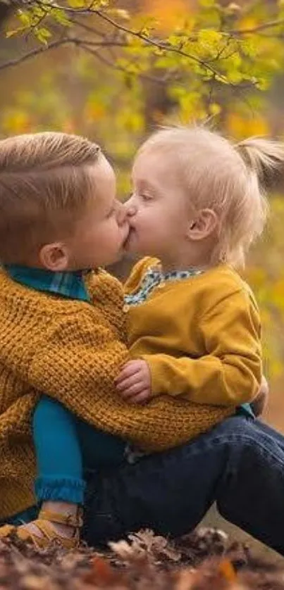 Adorable children in autumn attire surrounded by vibrant fall leaves.