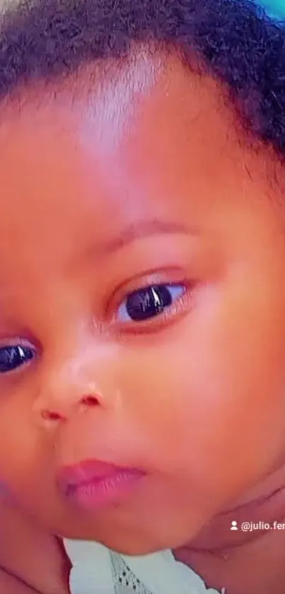 Close-up portrait of an adorable baby with a heartwarming expression.