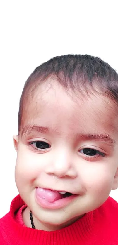 Adorable baby smiling in red sweater against white background.