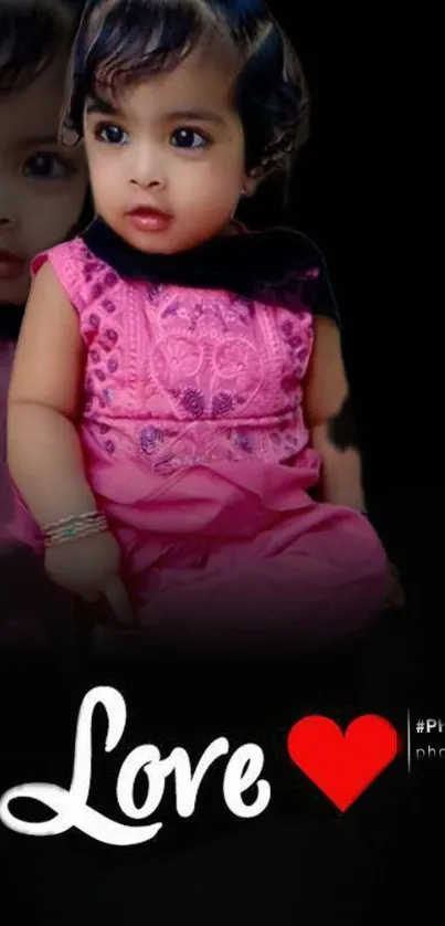 Adorable baby in pink dress with love heart on black background.