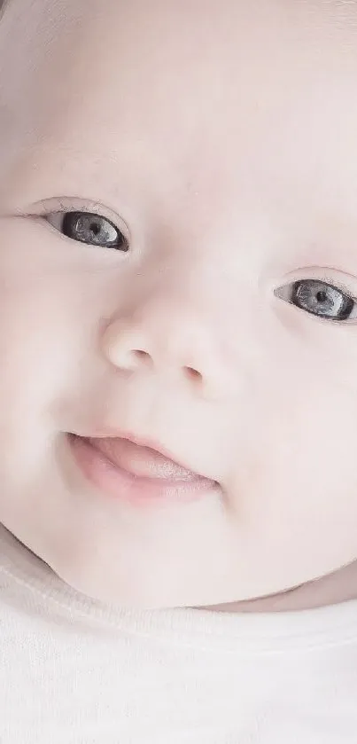 Adorable baby smiling with soft background, perfect for mobile wallpaper.