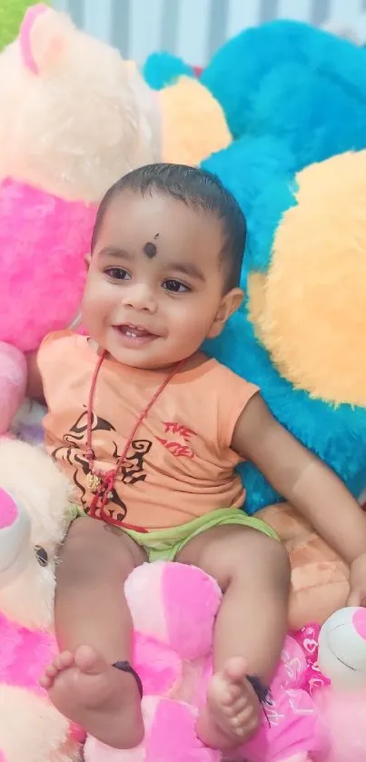 Smiling baby surrounded by colorful soft toys.