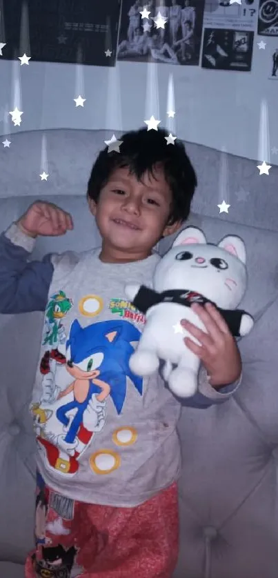 Smiling child with plush toy in cozy bedroom wallpaper.