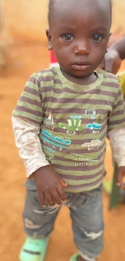 Adorable child in casual attire in a warm setting.