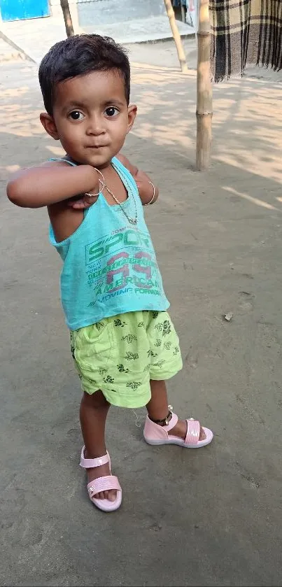 Young child in summer outfit looking adorable outdoors.