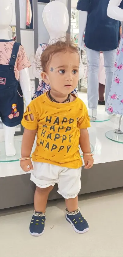 Adorable child in a clothing store with mannequins.