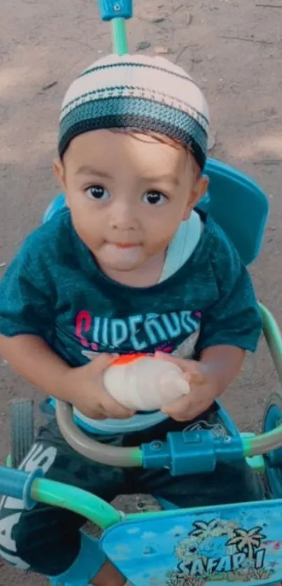 Adorable child on a bright tricycle outdoors.