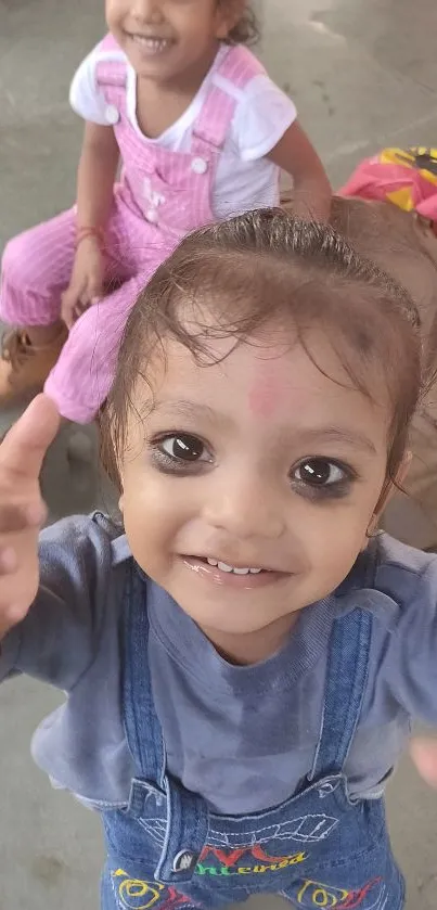 Two adorable kids smiling, capturing joyful innocence.