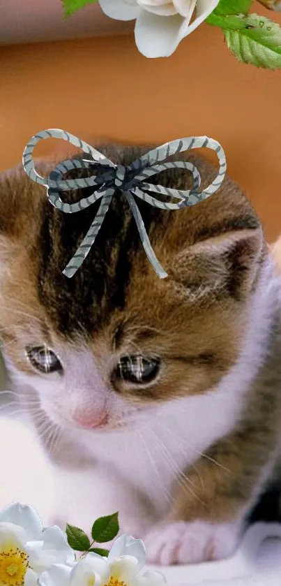 Adorable kitten with wings and flowers.