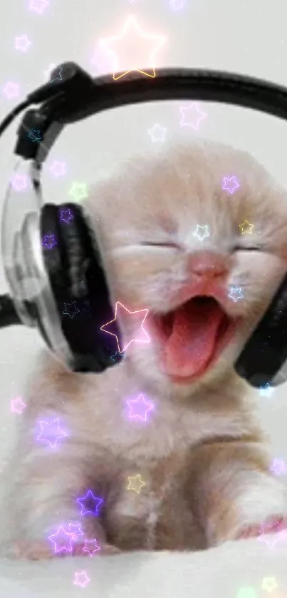 Adorable kitten with headphones and glowing stars wallpaper.