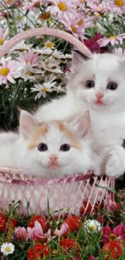 Two fluffy kittens resting in a basket surrounded by flowers.