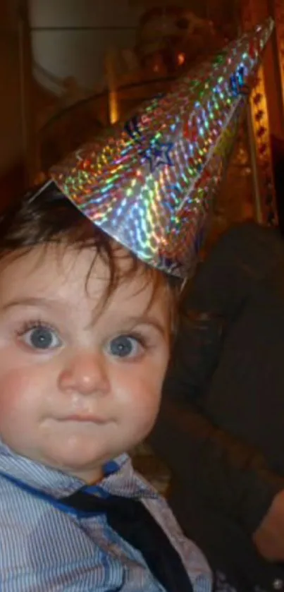 Cute baby wearing a sparkling party hat.