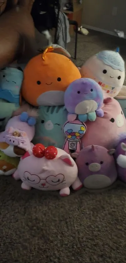 A vibrant collection of plush toys in various pastel colors, perfect for wallpaper.