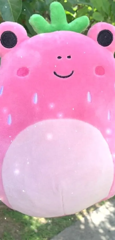 Adorable pink plush toy with a smile.