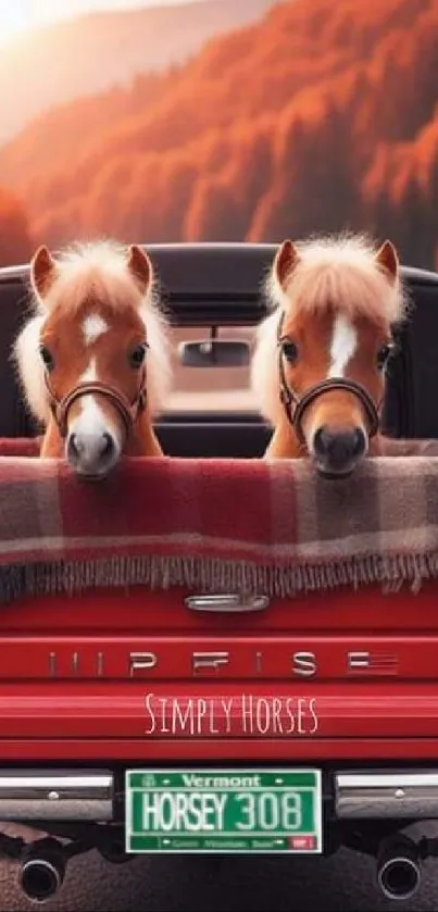 Two cute ponies in a red truck with scenic autumn background.