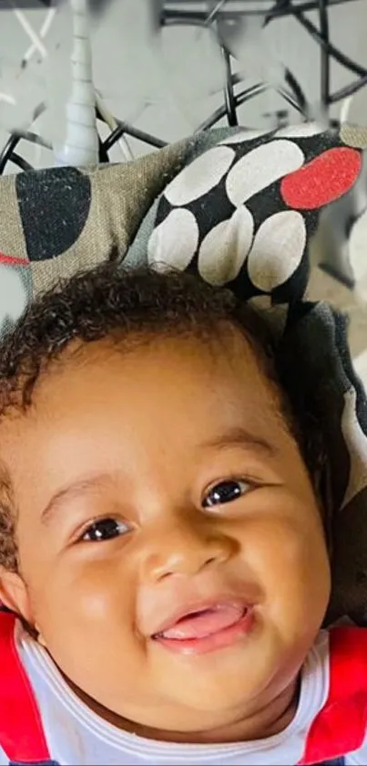 Smiling baby with a colorful background.