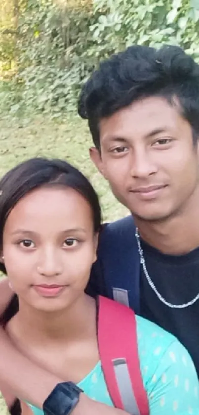 Young couple enjoying a nature hike, surrounded by greenery.