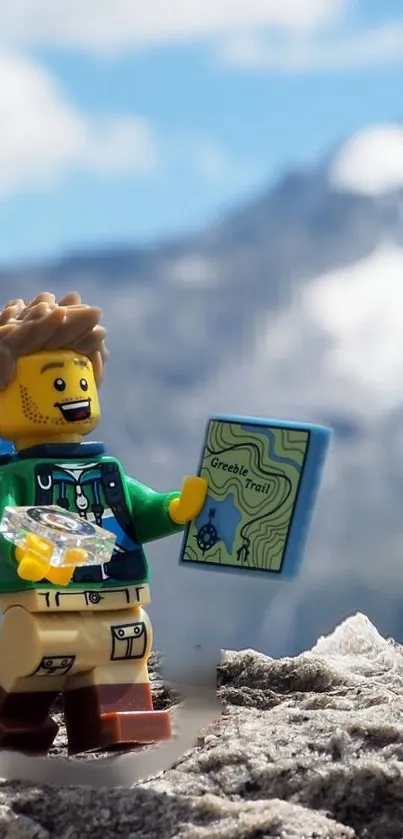 Lego figure holding a map with mountains in the background.