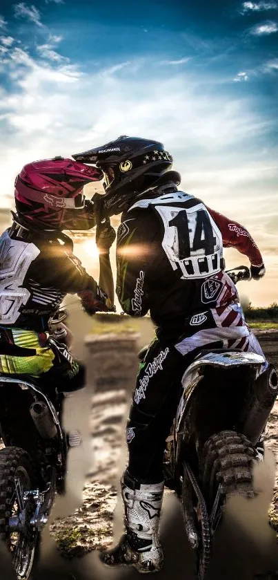 Two motorcyclists at sunset with a beautiful scenic background.