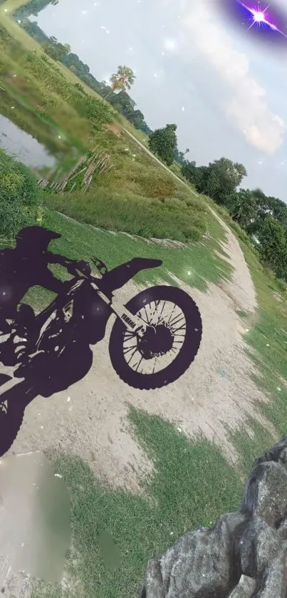 Silhouette of a motorcycle on a scenic trail background.