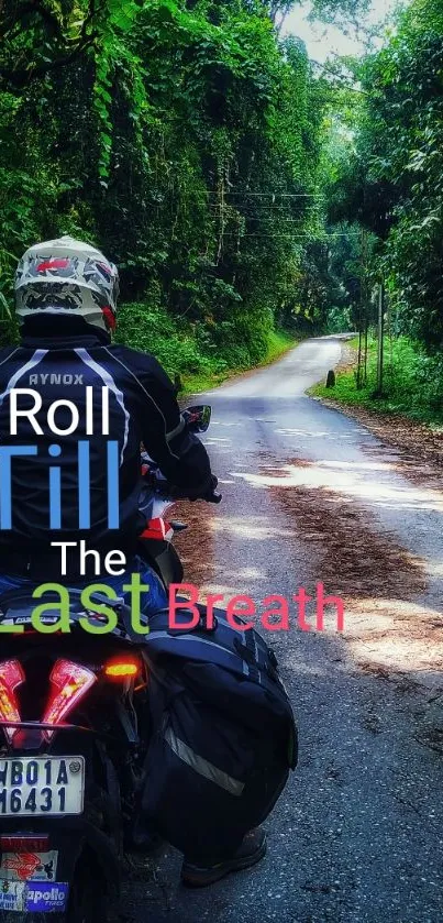 Motorcyclist rides through lush forest.