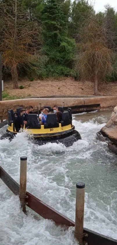 Yellow raft on water ride in lush green setting.