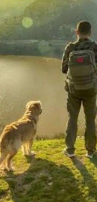 Hiker with backpack and dog overlooking a scenic mountain lake at sunset.