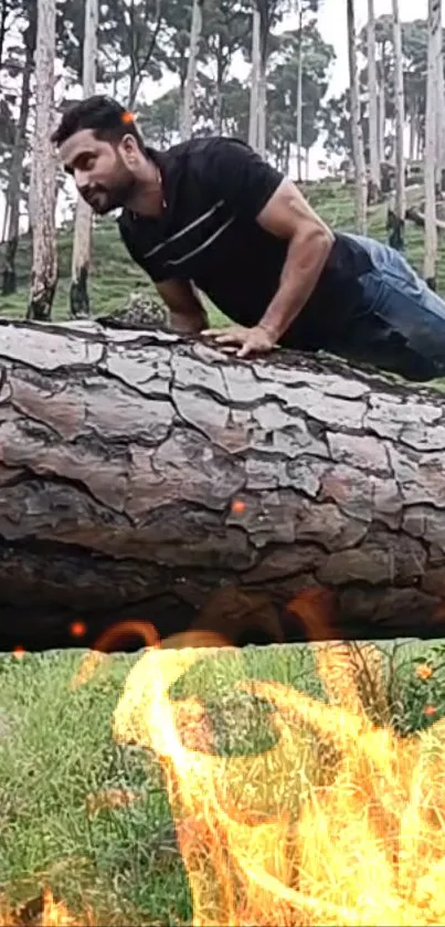 Man exercising outdoors on a log with fire and green forest backdrop.