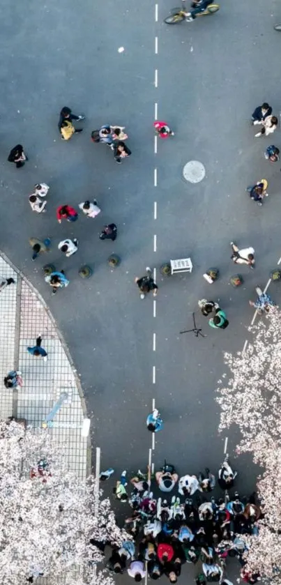 Aerial view of a busy city street crossing with pedestrians.